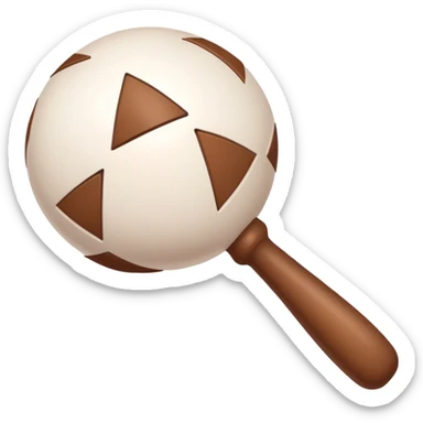 White rattle with triangles drawn on it in brown but filled in white sticker