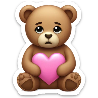 Teddy bear with sad eyes holding a pink heart sticker