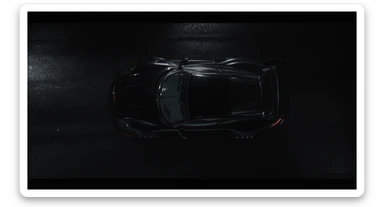 Cinematic shot of a porsche 911 gt3 rs, top dutch angle, black voide around, top spotlight, captured on arri alexa sticker