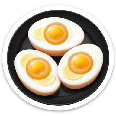 Two boil eggs in a black plate cut in half sticker