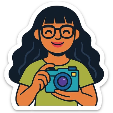 girl with long wavy black hair, bangs, black glasses, pink lip gloss, holding a teal camera, smiling with closed mouth, light moss green shirt, colorful illustration, friendly and modern style sticker
