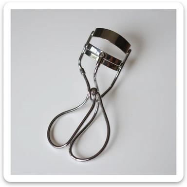 silver eyelash curler, close-up view, detailed, chrome finish sticker
