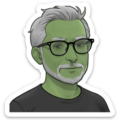 Indian man with grey hair,grey glasses, small beard and black t-shirt sticker