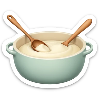 A cream ceramic baking bowl with a wooden spoon in it sticker