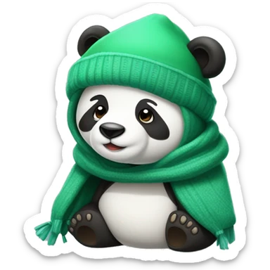 Un osos panda tapado con una manta verde y con gorro de invierno sticker