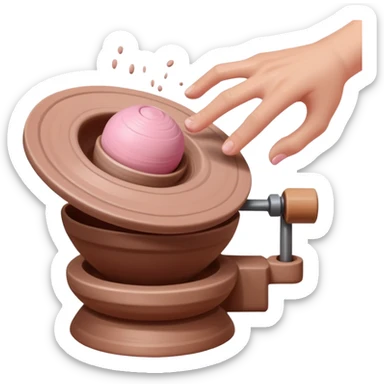 one hand throwing a pink ball of clay onto a spinning pottery wheel sticker