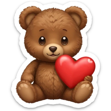 A tiny brown teddy bear next to a brown heart sticker