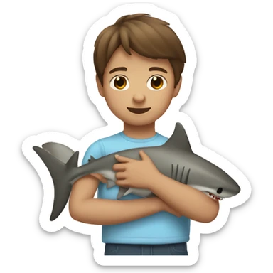 Tan little boy with straight brown hair cuddling a shark sticker