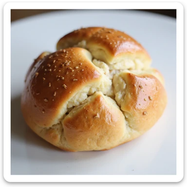 A Brioche Pasquier pain au lait, whole and inviting, styled to look soft, fresh, and delicious. sticker