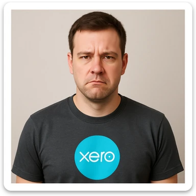 man with short brown hair, wearing a Xero software company t-shirt, looking not amused, neutral background sticker