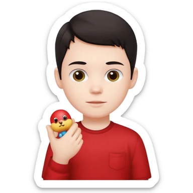 dark haired red wearing kid with small toy sticker
