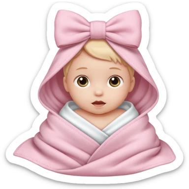 Baby in a light pink blanket with a white bow sticker