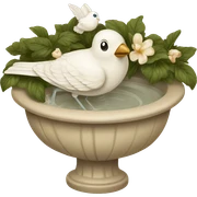 Vintage beige bird bath with a white bird sticker