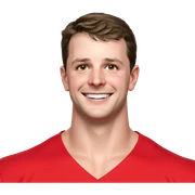smiling boy in red shirt sticker