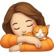 Girl with Brown hair sleeps with orange cat sticker