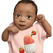 young boy enjoying fruit sticker