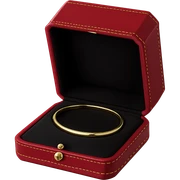 cartier red box, open with jewelry inside, gold accents, luxury, no text sticker