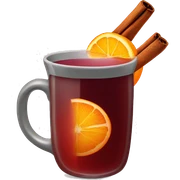 A Christmas mug of hot mulled wine, steaming with a cinnamon outside and an orange slice next to it sticker