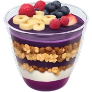 Açaí in a clear cup with layers of fruits and granola and condensed milk sticker