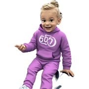 smiling boy sitting by car sticker