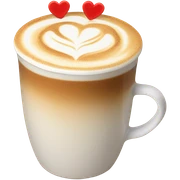 A creamy latte in a frothy cup with a heart-shaped foam art design labeled “Creator Fuel.” sticker