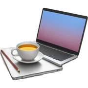 Laptop with a cup of tea beside sticker