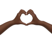 Two hands making a heart sticker