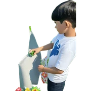 boy with flower in grass sticker