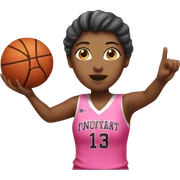 a female shooting a basketball wearing pink sticker