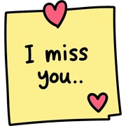 Sticky note that says "I miss you" with a heart sticker