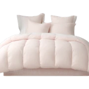Pale pink comforter and white pillows on bed sticker