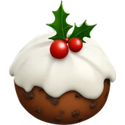 Christmas pudding with white icing and a sprig of holly sticker