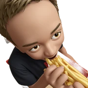 boy enjoying french fries indoors sticker