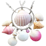 Pink seashells and white seashells on a charm necklace sticker