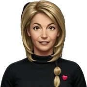 blonde girl smiling against black sticker