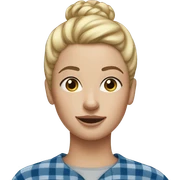 Blonde woman with freckles, blonde hair in a high bun, blue flannel, and gap in her tee sticker