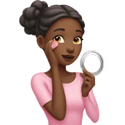 Girl putting on pink blush sticker