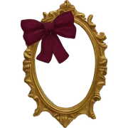 Vintage mivintage mirror with handle and burgundy bow sticker