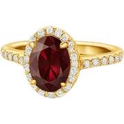 Gold oval engagement ring with burgundy diamond sticker