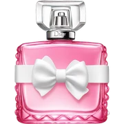 Pink Miss Dior perfume bottle with a small white bow on the lid sticker