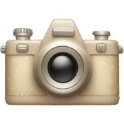 A vintage-inspired camera in soft beige with a subtle glow and sparkles. sticker