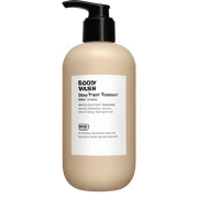 Beige bottle of body wash with a matte black pump top sticker