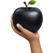 Hand holding a black apple sticker