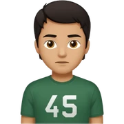 A man with hair wearing a t-shirt that says the number 456 in dark green and white  sticker