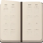 A neutral-toned planner open to a minimalist calendar layout, accented with tiny checkmarks. sticker