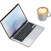 MacBook, latte in a cup, and a notebook sticker
