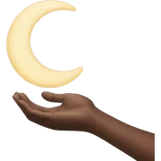 Hand while holding a moon sticker