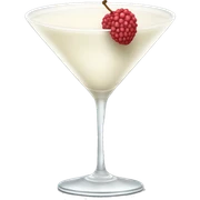A creamy white colored liquid in a martini glass with a skinless lychee garnish  sticker