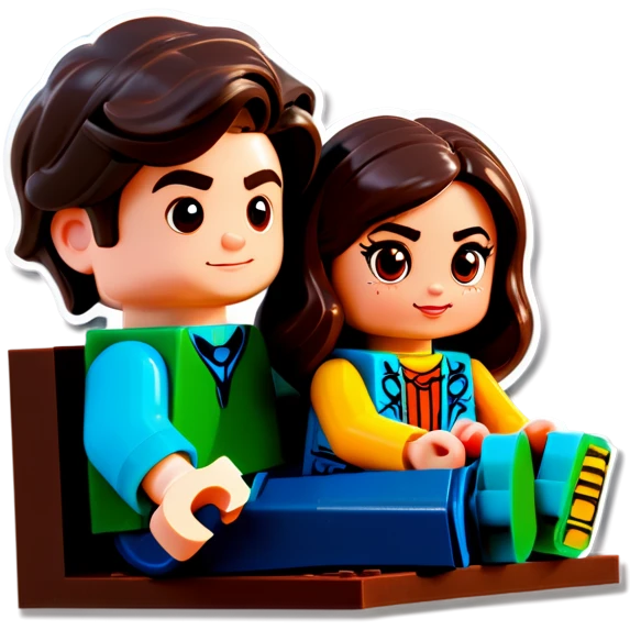 A handsome young man with dark hair, a little heavy sits with his girlfriend with cascading, dark brown hair, flowing down her face as they sit together playing Legos emoji