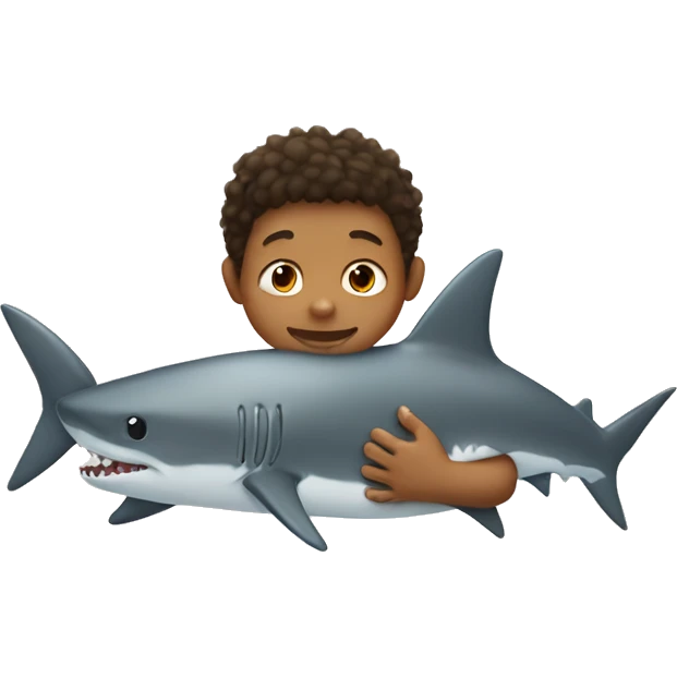 Tan little boy cuddling a shark emoji